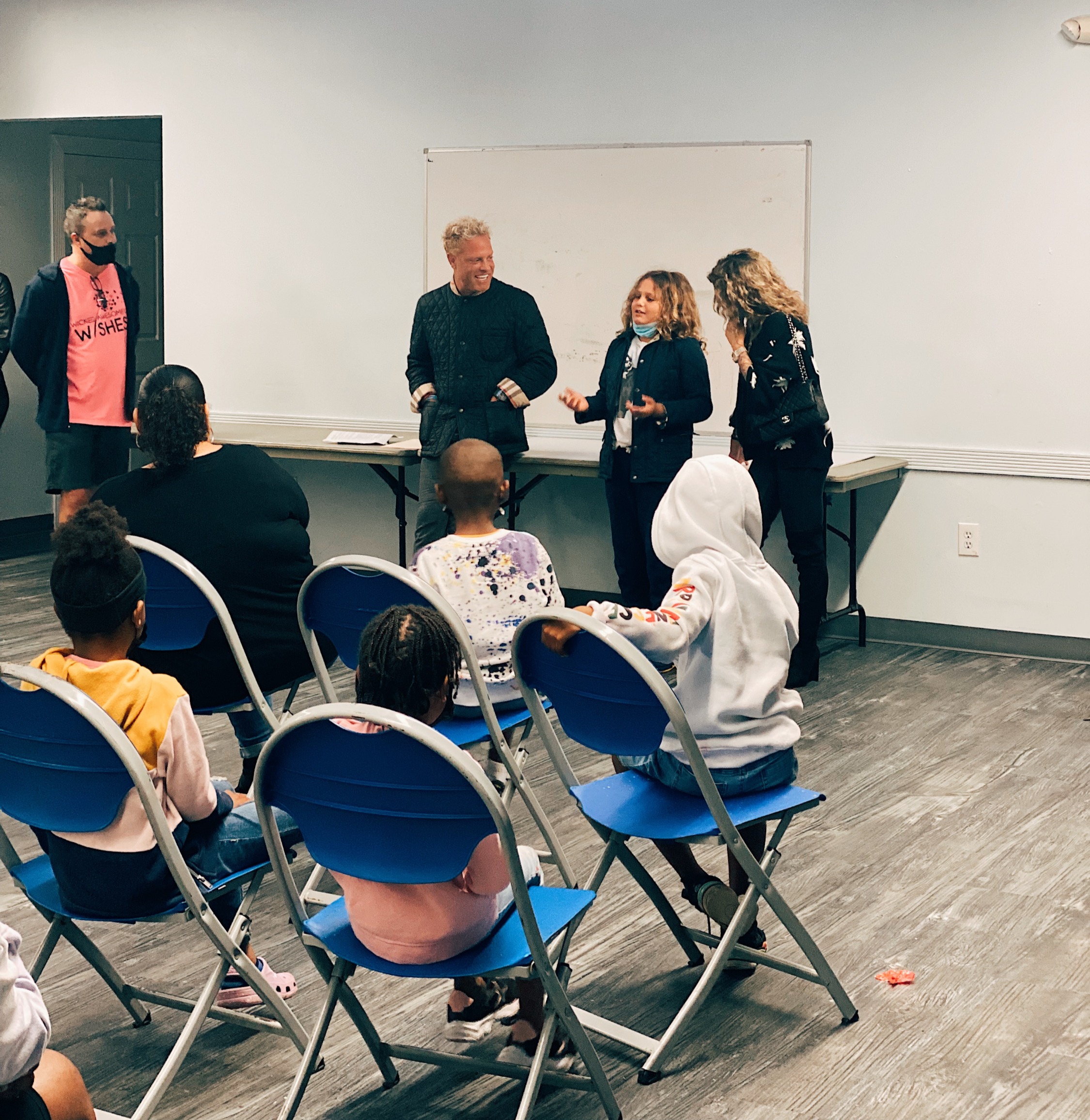 Chad Johnson, Jenny Johnson, Axl Johnson, and JoJo Natson meet with children from the SOS Children's Villages program.