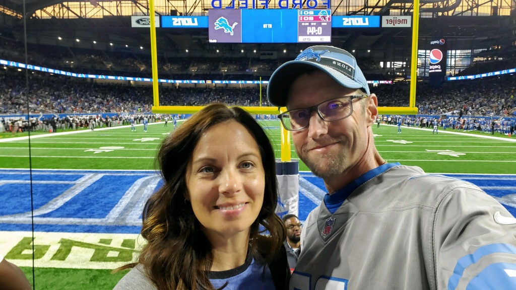 Scott Assenmacher and his wife; frontline at a Detroit Lion's game